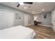 Bright bedroom featuring a workspace and wood-look floors at 1020 Hanford Dr, Deltona, FL 32738