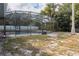 Screened-in pool with surrounding grassy area at 1020 Hanford Dr, Deltona, FL 32738