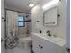 Clean bathroom with a white vanity and updated fixtures at 1020 Hanford Dr, Deltona, FL 32738