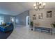 Elegant entryway with a bench and modern art pieces at 1020 Hanford Dr, Deltona, FL 32738