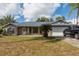 Brick house with attached garage and landscaping at 1020 Hanford Dr, Deltona, FL 32738