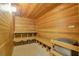 Clean and well-maintained sauna with wooden interior at 4650 Links Village Dr # C303, Ponce Inlet, FL 32127