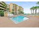 Community pool with plenty of lounge chairs at 4650 Links Village Dr # C303, Ponce Inlet, FL 32127