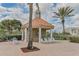 Relaxing gazebo with lounge chairs near the pool and BBQ grills at 4650 Links Village Dr # C303, Ponce Inlet, FL 32127