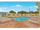 Bright and sunny community pool with lounge chairs at 4650 Links Village Dr # C303, Ponce Inlet, FL 32127