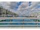 Waterfront view of marina with many boats and resort-style building at 4650 Links Village Dr # C303, Ponce Inlet, FL 32127