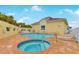 Relaxing pool and spa area with lounge chairs at 4650 Links Village Dr # C303, Ponce Inlet, FL 32127