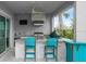 Outdoor kitchen with grill, bar seating, and granite countertops at 53 Marden Dr, Ormond Beach, FL 32176
