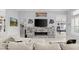 Living room features a large sectional sofa and a modern fireplace at 53 Marden Dr, Ormond Beach, FL 32176