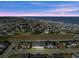 An aerial view of a house near the coast, showcasing the neighborhood and ocean at 53 Marden Dr, Ormond Beach, FL 32176