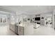 Modern kitchen with large island and adjacent living area with sectional sofa at 53 Marden Dr, Ormond Beach, FL 32176