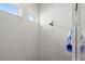 Clean shower with marble-look tile and single shower head at 53 Marden Dr, Ormond Beach, FL 32176