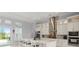 Modern kitchen with white cabinets, large island, and stainless steel appliances at 53 Marden Dr, Ormond Beach, FL 32176