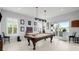 Game room with pool table, plenty of space for entertainment at 53 Marden Dr, Ormond Beach, FL 32176