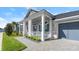 Two story home with front porch and gray garage at 53 Marden Dr, Ormond Beach, FL 32176