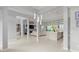 Open living space with high ceilings, marble island, and large windows at 53 Marden Dr, Ormond Beach, FL 32176