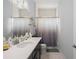 Bathroom with dark vanity, quartz countertop, and shower/tub combo at 53 Marden Dr, Ormond Beach, FL 32176