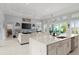 Open concept kitchen and living room with large island and seating at 53 Marden Dr, Ormond Beach, FL 32176