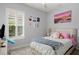 Bedroom with a bed, window with shutters, and various decor at 53 Marden Dr, Ormond Beach, FL 32176