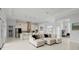 Open floor plan with modern kitchen, large island, and adjacent living area at 53 Marden Dr, Ormond Beach, FL 32176
