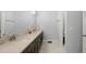 Bathroom features a double vanity and access to bedroom at 53 Marden Dr, Ormond Beach, FL 32176