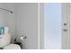Bathroom with toilet and frosted glass door at 53 Marden Dr, Ormond Beach, FL 32176