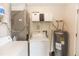 Small laundry room with washer, dryer, and water heater at 1230 8Th Ave, Deland, FL 32724