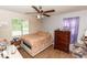 Bedroom with double bed, dresser, and ceiling fan at 1230 8Th Ave, Deland, FL 32724