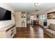 Open concept living and dining area with wood floors at 1230 8Th Ave, Deland, FL 32724