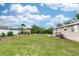 Large backyard with grassy area and shed at 1230 8Th Ave, Deland, FL 32724