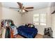 Bedroom with double bed, clothing rack, and ceiling fan at 1230 8Th Ave, Deland, FL 32724
