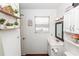 Bright bathroom with white vanity and shelving at 1230 8Th Ave, Deland, FL 32724