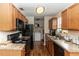 Clean kitchen with black appliances and wood cabinets at 1230 8Th Ave, Deland, FL 32724