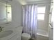 Updated bathroom with white vanity, shower/tub combo, and new fixtures at 201 N Hill Ave # 150, Deland, FL 32724