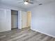 Spacious bedroom featuring new flooring and dual closets at 201 N Hill Ave # 150, Deland, FL 32724