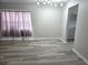 Bright dining area with gray vinyl plank flooring and neutral decor at 201 N Hill Ave # 150, Deland, FL 32724