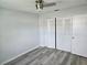 Bright bedroom with ceiling fan, new flooring, and large closet at 201 N Hill Ave # 150, Deland, FL 32724