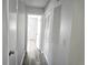 Light hallway with vinyl flooring and access to bedrooms at 201 N Hill Ave # 150, Deland, FL 32724