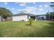 House exterior showcasing backyard and screened enclosure at 2063 Killinger St, Deltona, FL 32738