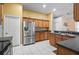 Kitchen with stainless steel refrigerator and wood cabinets at 2063 Killinger St, Deltona, FL 32738