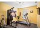 Home gym with Bowflex machine and treadmill at 2063 Killinger St, Deltona, FL 32738