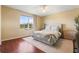 Main bedroom with hardwood floors and neutral decor at 450 Tradition Ln, Winter Springs, FL 32708