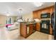 Kitchen with wooden cabinets and granite countertops at 450 Tradition Ln, Winter Springs, FL 32708