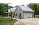 Two-story house with a large yard and a two-car garage at 5711 John Anderson Hwy, Flagler Beach, FL 32136