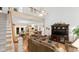 Spacious living area with high ceilings and a fireplace at 5711 John Anderson Hwy, Flagler Beach, FL 32136