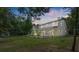 Two story house with screened porch and fenced backyard at 5711 John Anderson Hwy, Flagler Beach, FL 32136