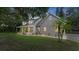 Two story house with front porch and manicured lawn at 5711 John Anderson Hwy, Flagler Beach, FL 32136
