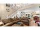 Open living room showcasing a two-story high ceiling, hardwood floors, and a comfortable sitting area at 5711 John Anderson Hwy, Flagler Beach, FL 32136