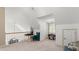 Light-filled upstairs sitting area with built-in desk and comfortable seating at 5711 John Anderson Hwy, Flagler Beach, FL 32136