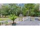 Deck with a grill overlooking a fenced backyard at 5711 John Anderson Hwy, Flagler Beach, FL 32136